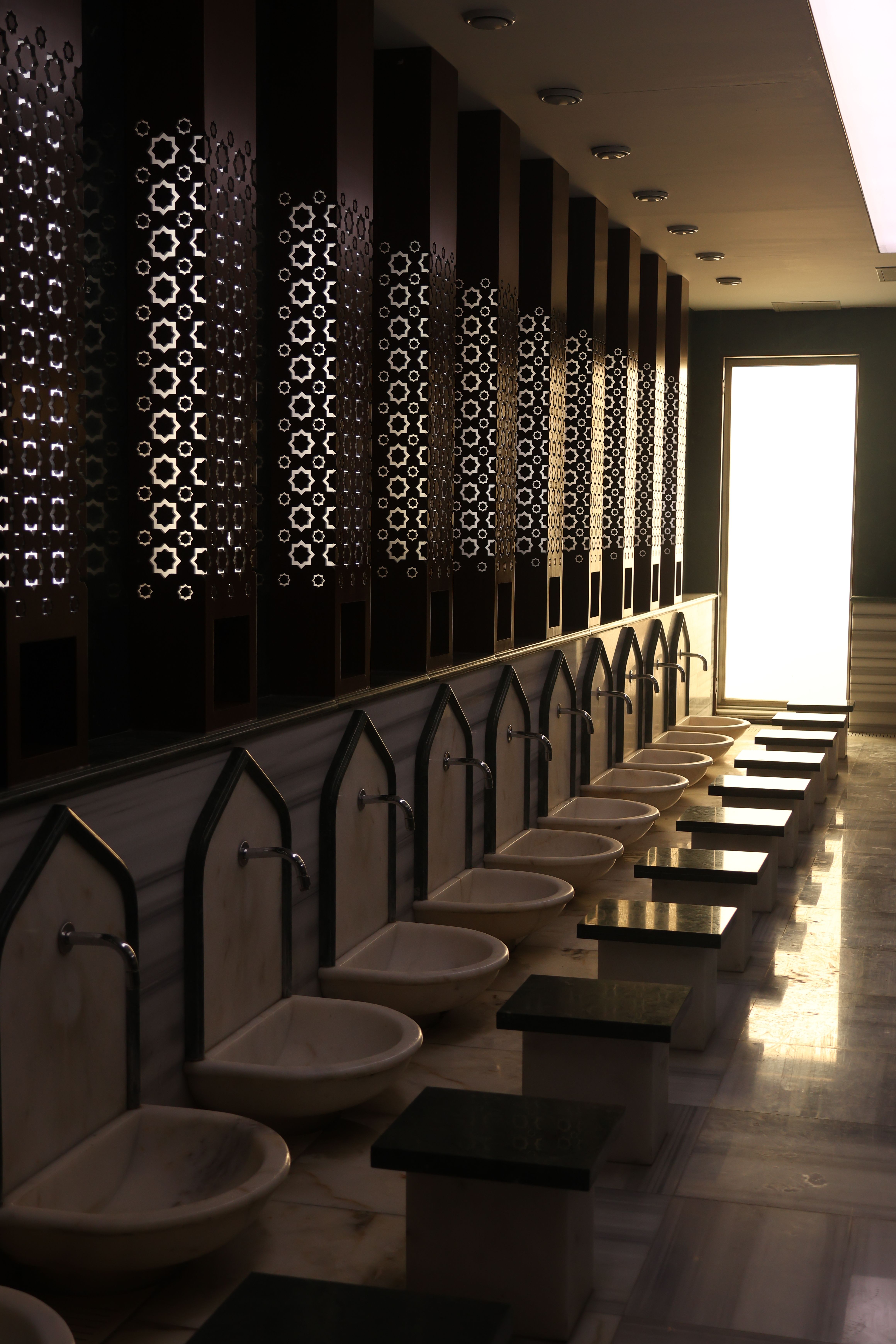 Row of traditional marble wash basins in an Istanbul hammam